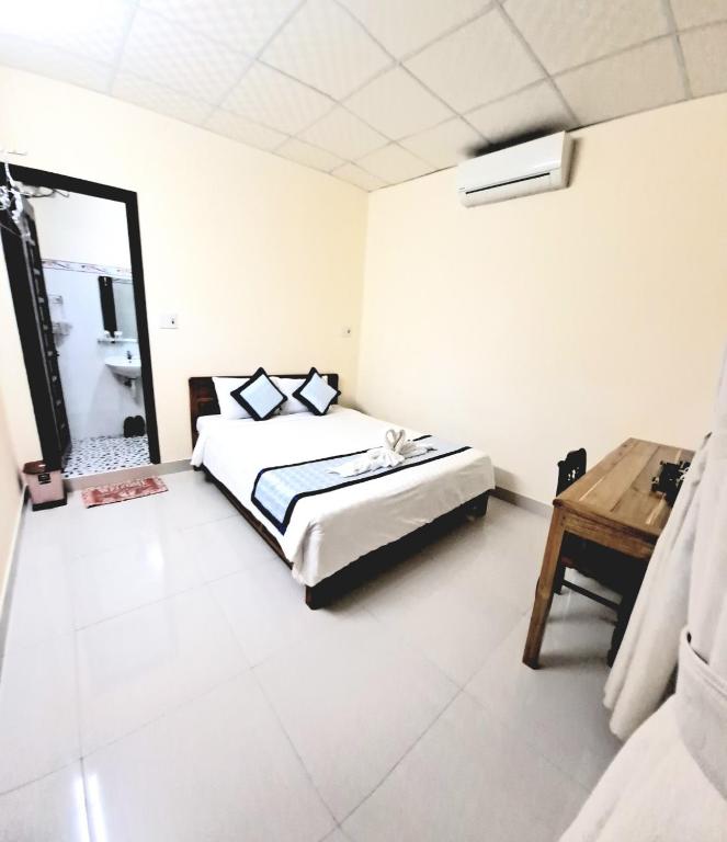 Postel nebo postele na pokoji v ubytování Blue Beach Homestay