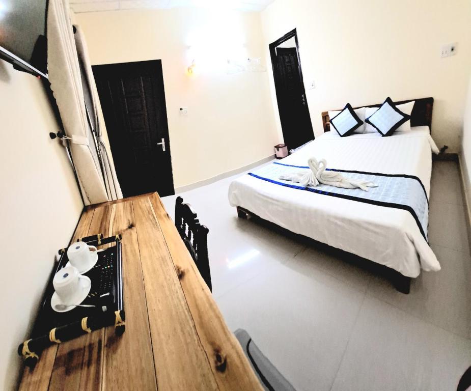 Postel nebo postele na pokoji v ubytování Blue Beach Homestay