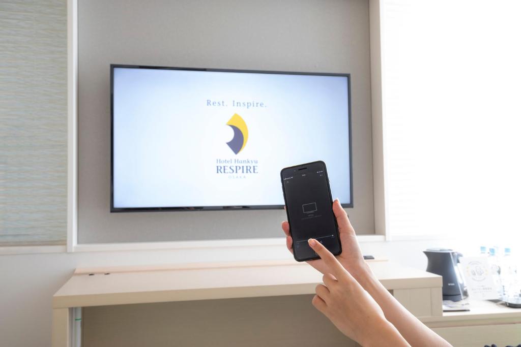 TV a/nebo společenská místnost v ubytování Hotel Hankyu RESPIRE OSAKA