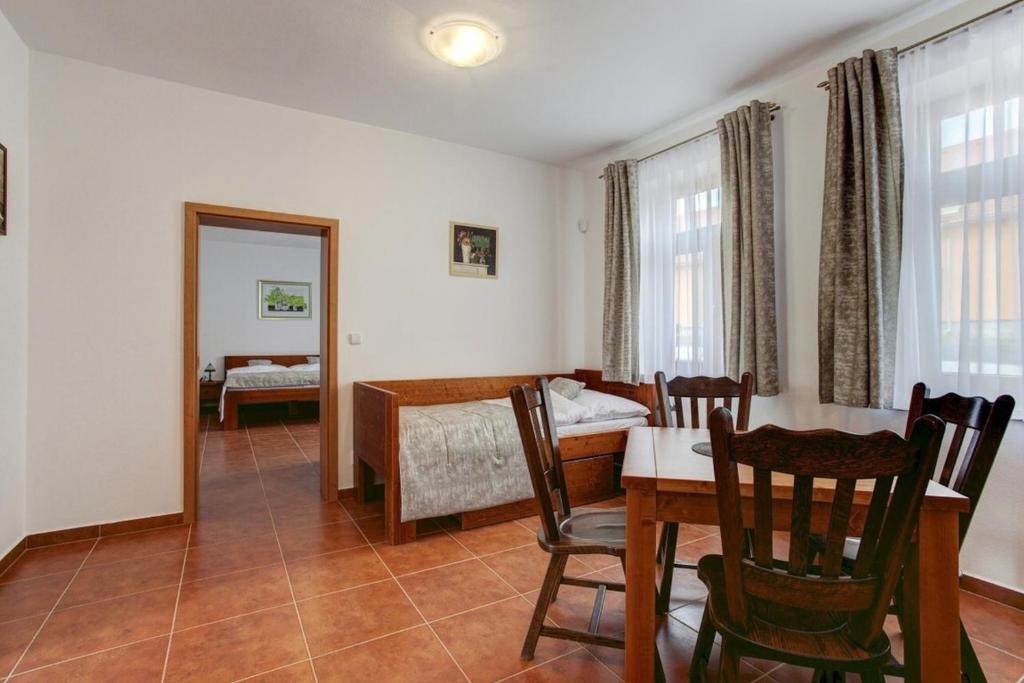 Postel nebo postele na pokoji v ubytování Apartmány U Anděla
