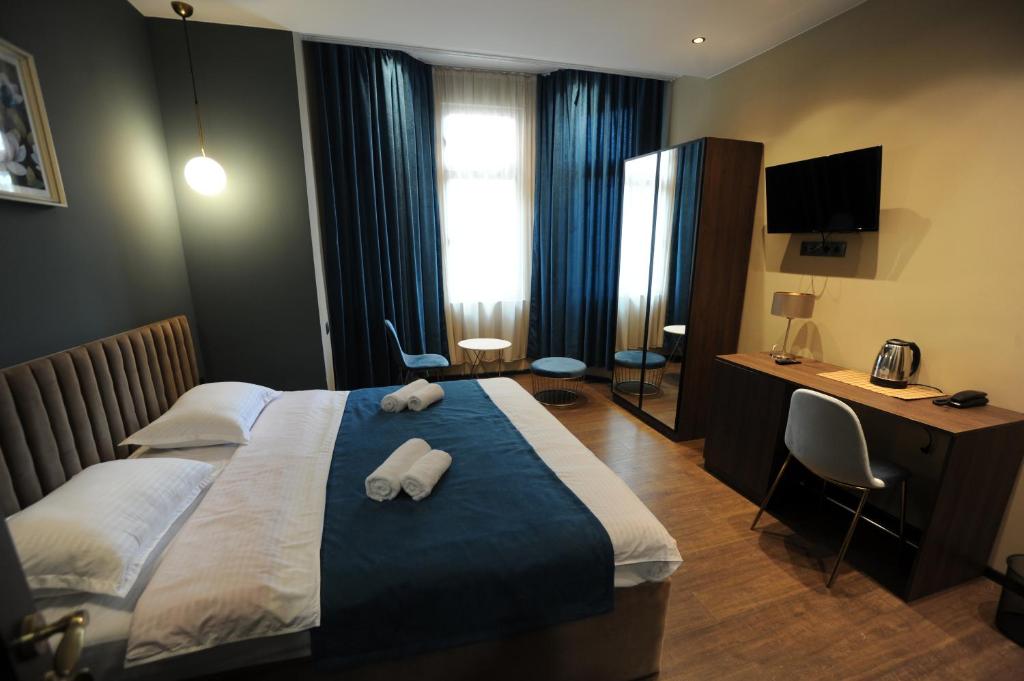 Postel nebo postele na pokoji v ubytování Hotel Verisima