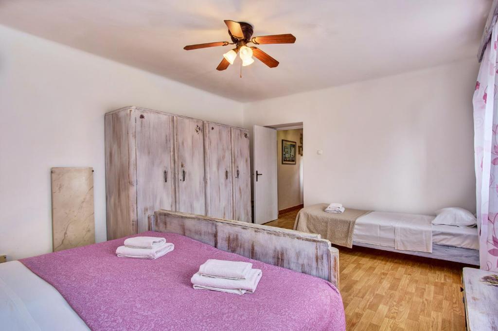 Posteľ alebo postele v izbe v ubytovaní Holiday Home Lina Cipollina