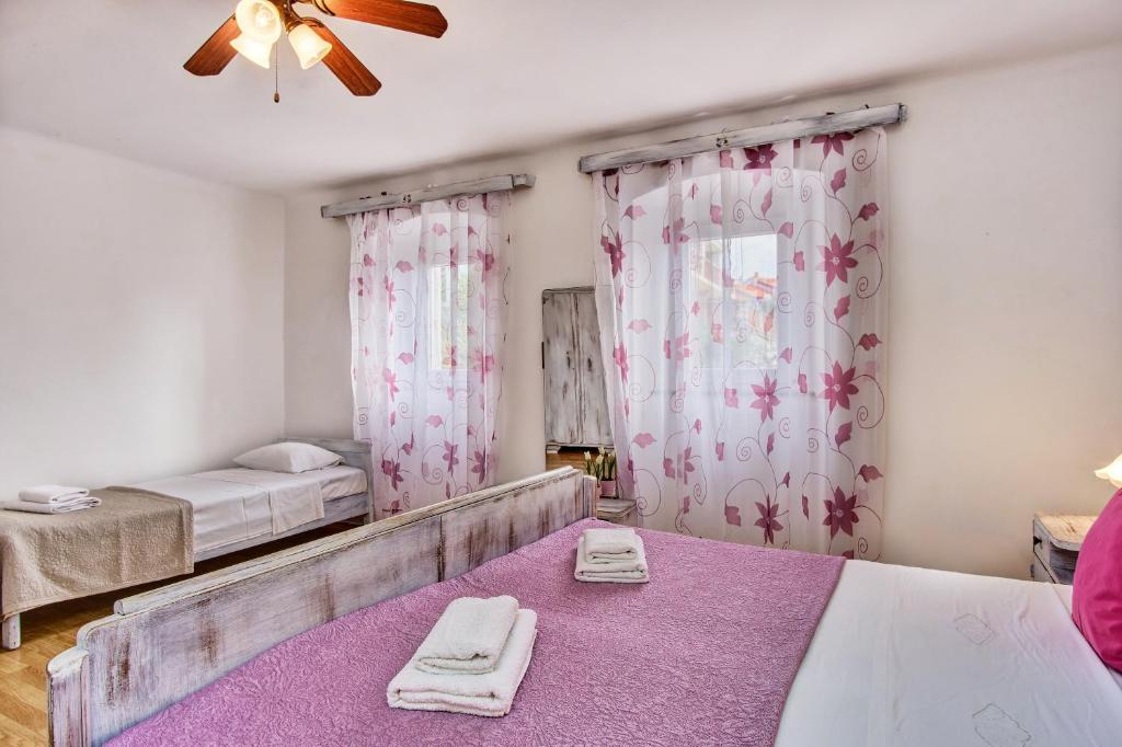 Posteľ alebo postele v izbe v ubytovaní Holiday Home Lina Cipollina