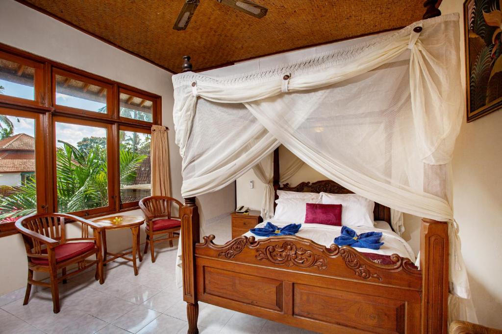Tempat tidur dalam kamar di Nick's Pension