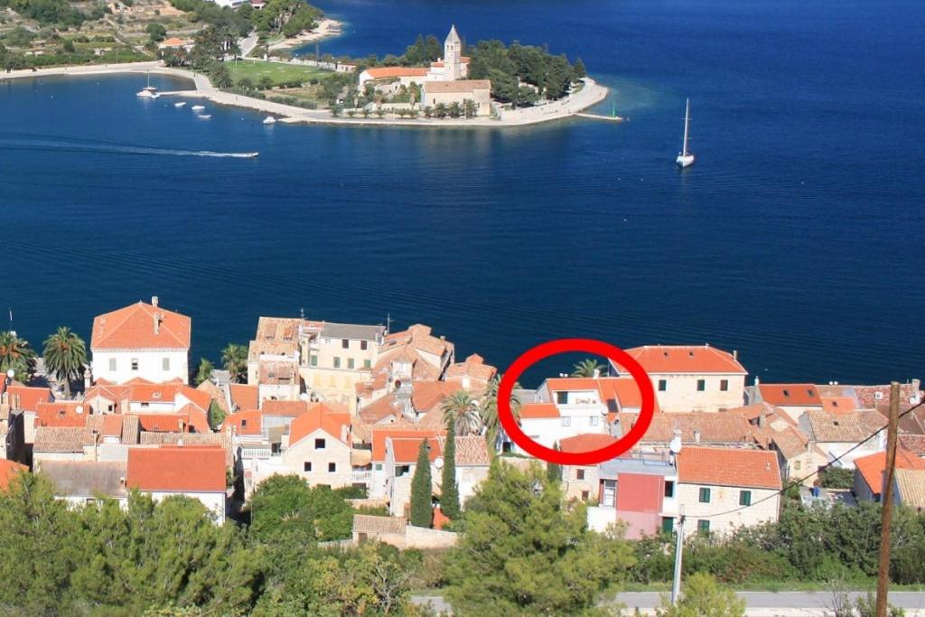 a red circle in the middle of a city at Apartments by the sea Vis - 8876 in Vis