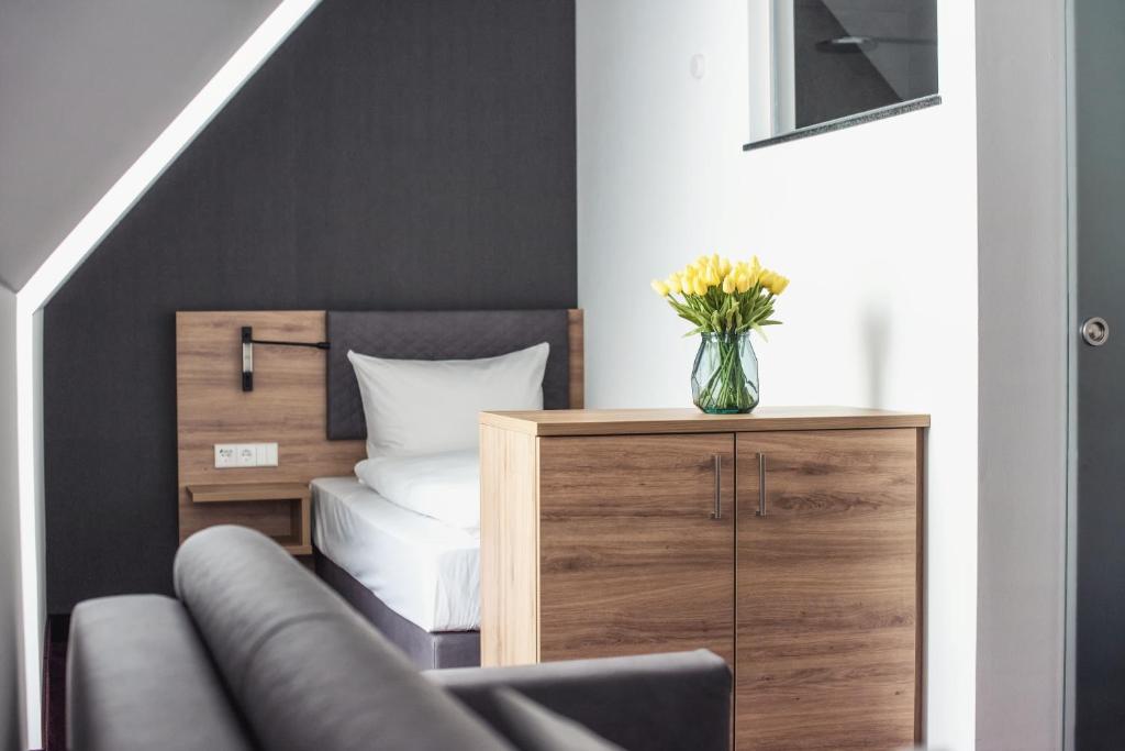 Postel nebo postele na pokoji v ubytování Hotel Kupferzell