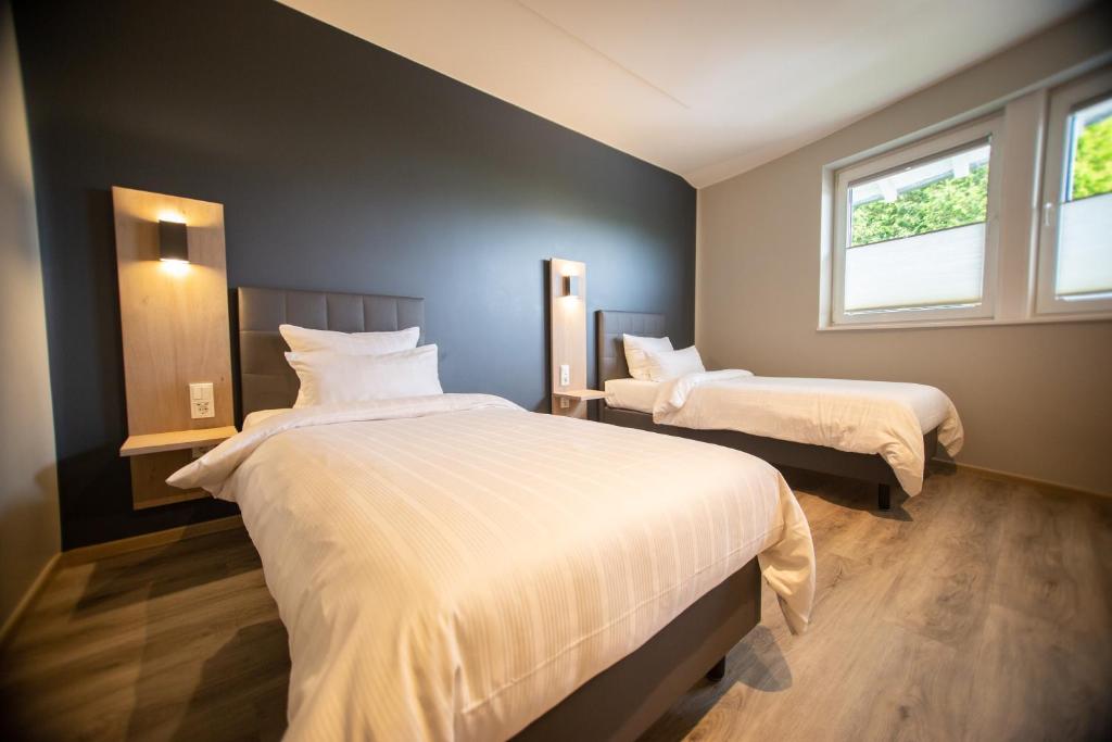 Postel nebo postele na pokoji v ubytování Hotel Circle Inn