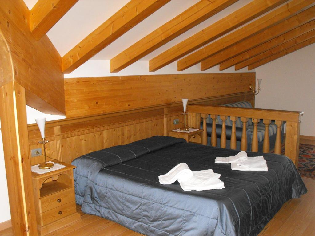 Postel nebo postele na pokoji v ubytování Hotel Sass Maor