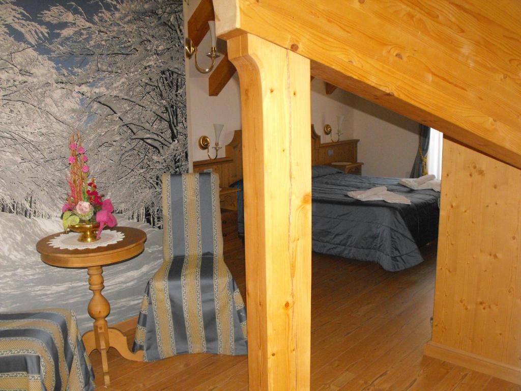 Postel nebo postele na pokoji v ubytování Hotel Sass Maor