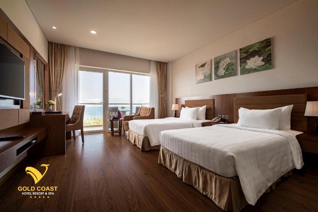 Postel nebo postele na pokoji v ubytování Gold Coast Hotel Resort & Spa