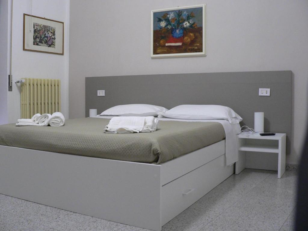 Postel nebo postele na pokoji v ubytování Locanda Pezzolla