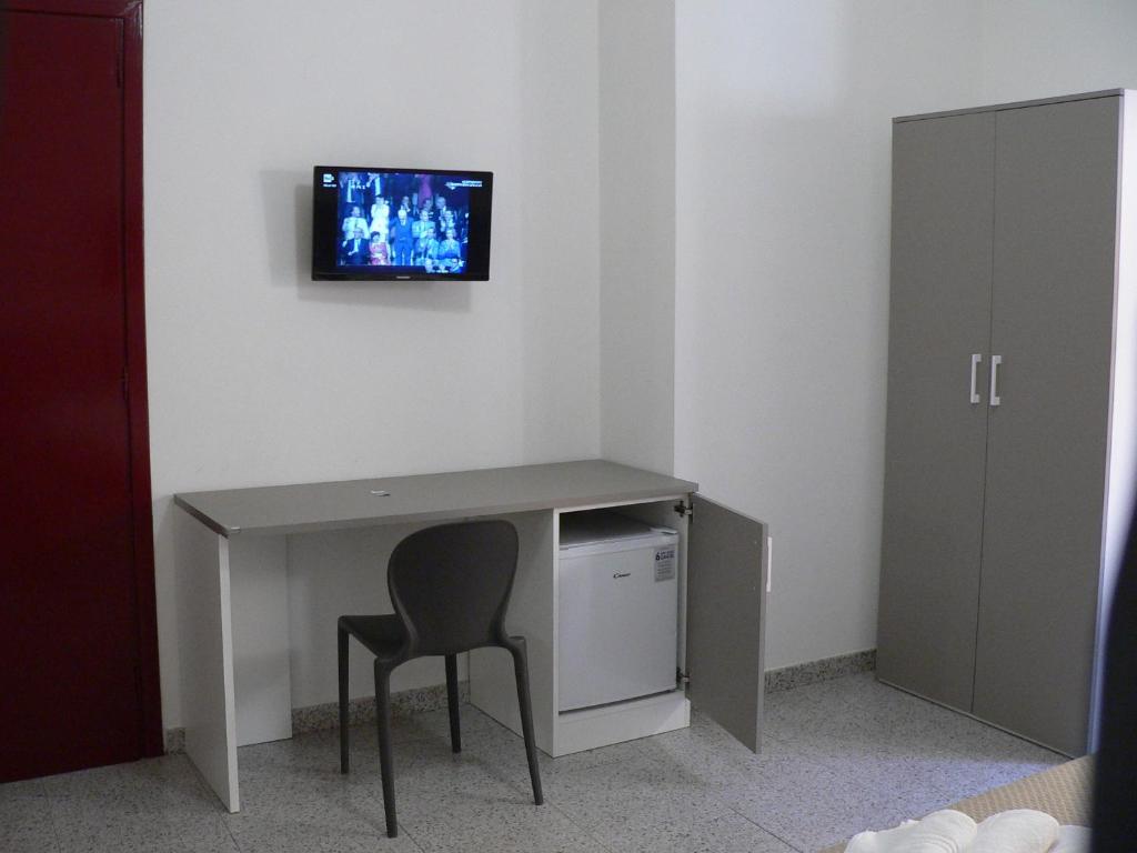 TV a/nebo společenská místnost v ubytování Locanda Pezzolla