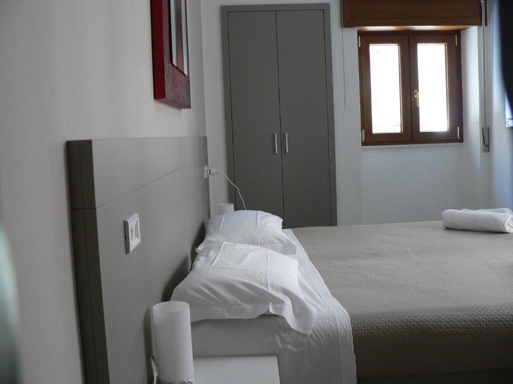 Postel nebo postele na pokoji v ubytování Locanda Pezzolla