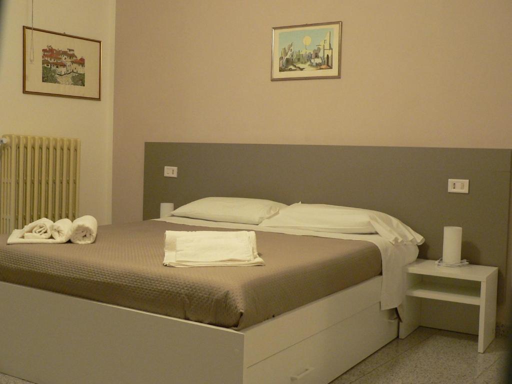 Postel nebo postele na pokoji v ubytování Locanda Pezzolla