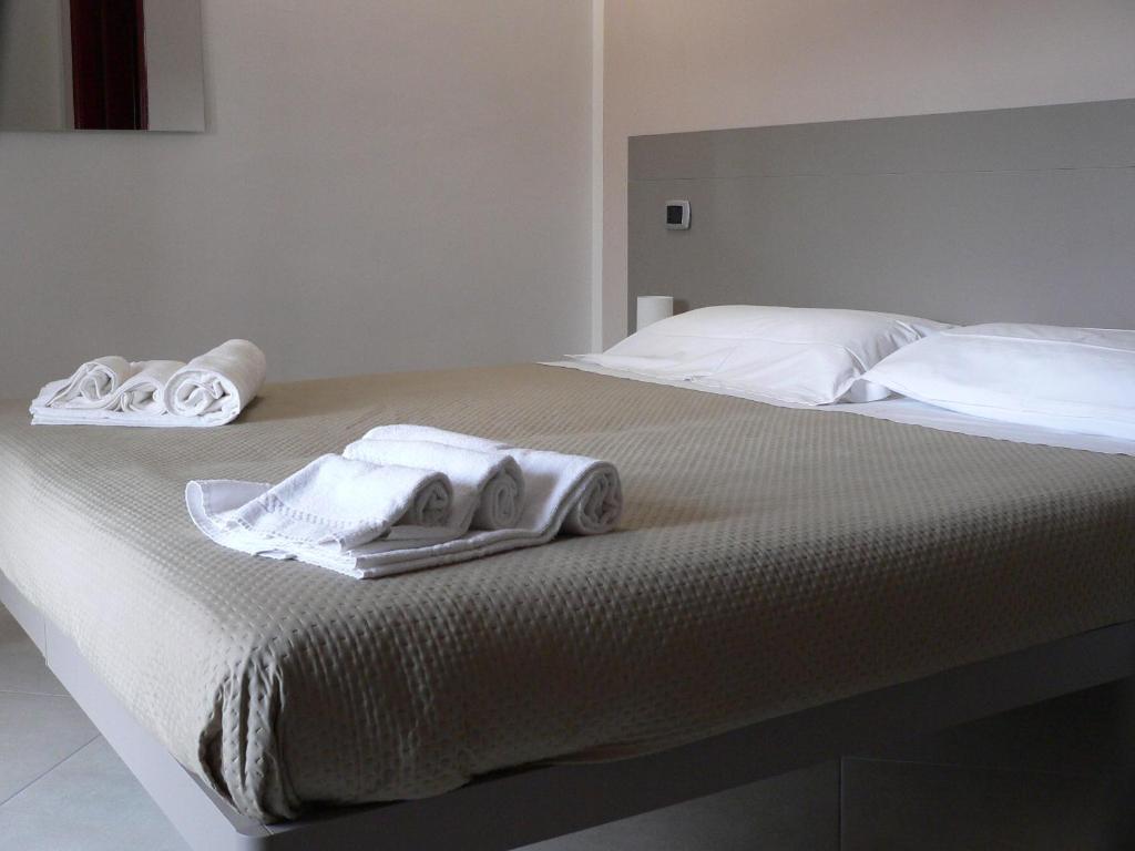 Postel nebo postele na pokoji v ubytování Locanda Pezzolla