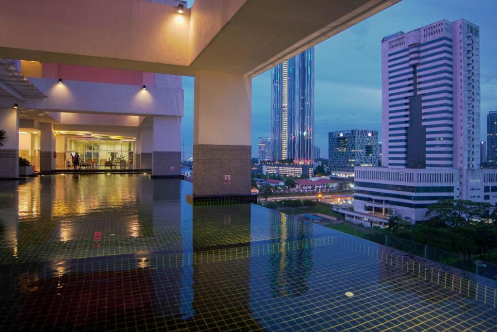 a building with a view of a city at night at Twin Galaxy Suite by Nest Home in Johor Bahru