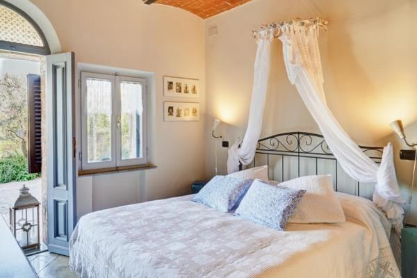 Postel nebo postele na pokoji v ubytování B&B Daria - Deb'S Monticchiello