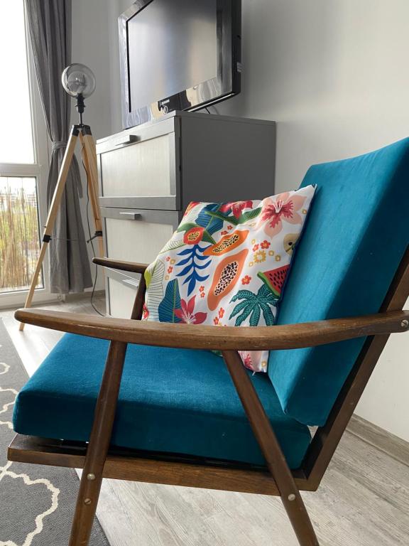 Televízia a/alebo spoločenská miestnosť v ubytovaní Słoneczny apartament