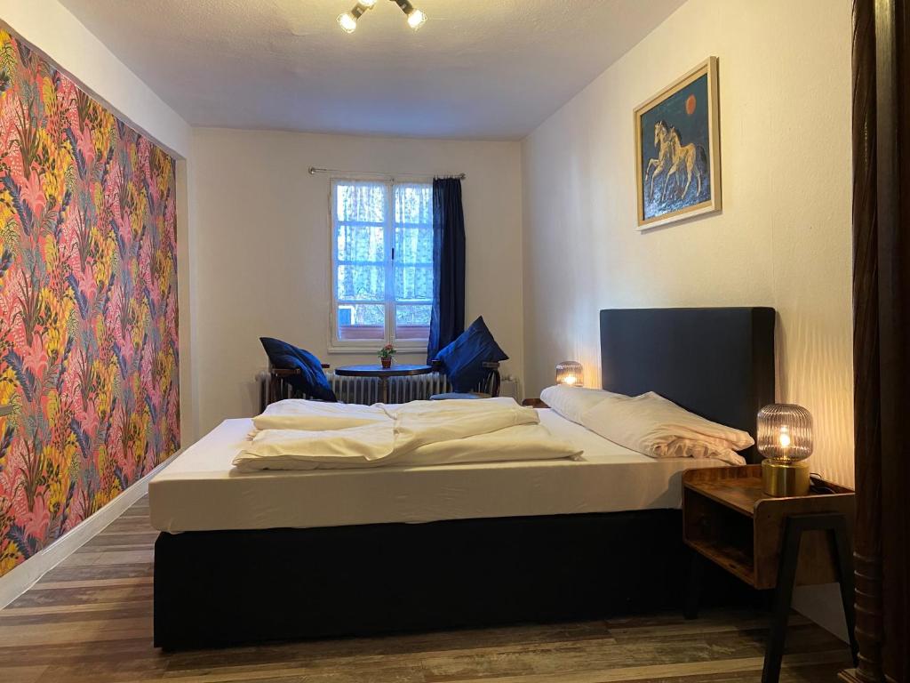 Postel nebo postele na pokoji v ubytování ReSt Inn Monschau