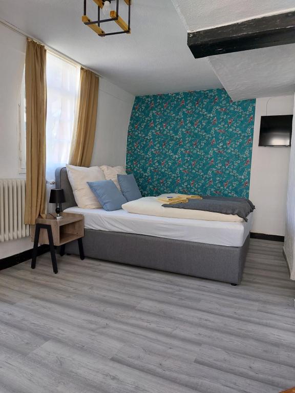 Postel nebo postele na pokoji v ubytování ReSt Inn Monschau