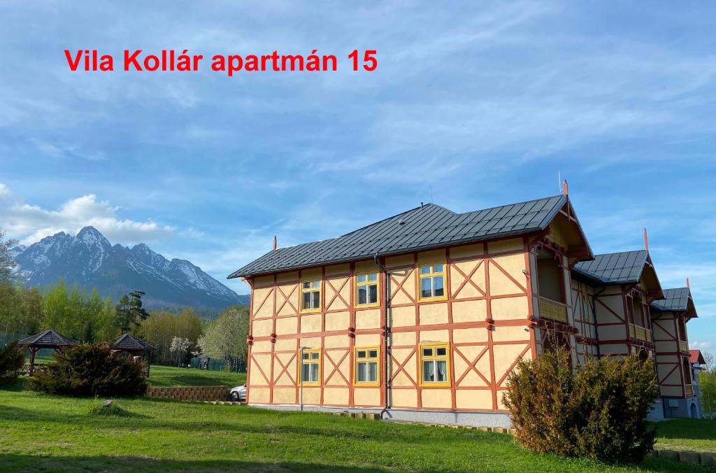a house in a field with mountains in the background at Vila Kollár Apartmán 15 in Dolný Smokovec