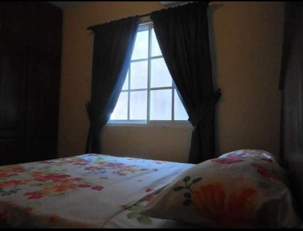Кровать или кровати в номере Apartamentos ipap luperon