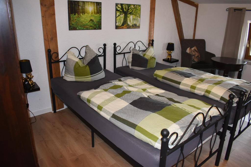 two beds sitting in a room with at Radlerzimmer Neu Gaarz für 2 Personen in Neu Gaarz