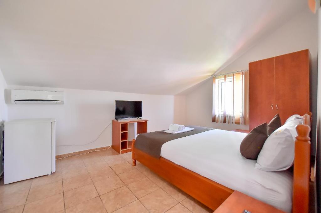 Postel nebo postele na pokoji v ubytování VILA HAVEN - Camere de inchiriat