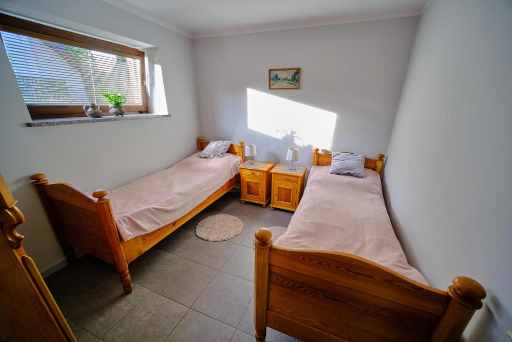 Posteľ alebo postele v izbe v ubytovaní Apartament Przy Beczce