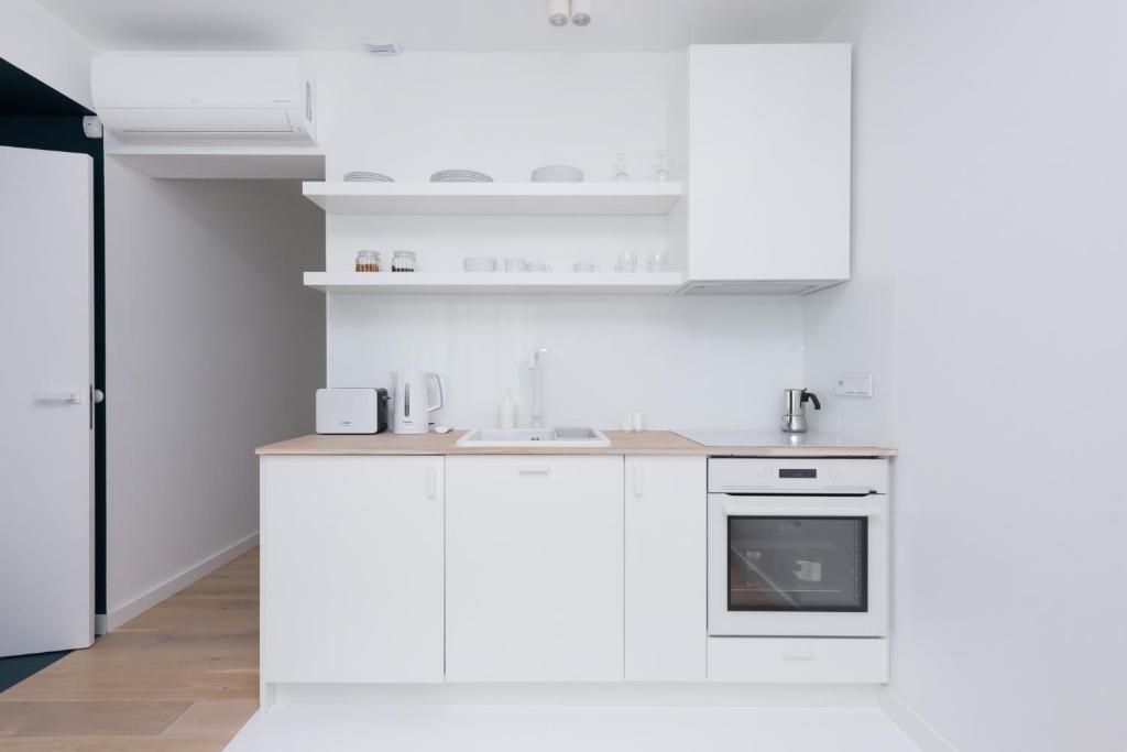 Kuchyňa alebo kuchynka v ubytovaní Colors Apartments Zator - tylko 10 minut piechotą od Energylandii