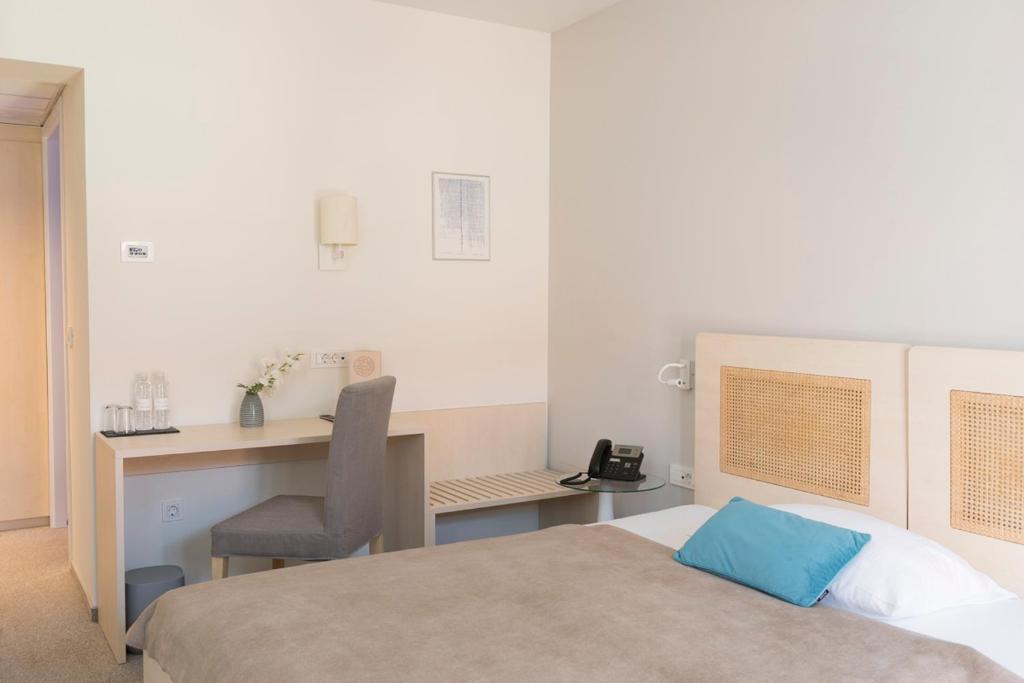 Postel nebo postele na pokoji v ubytování Art Hotel