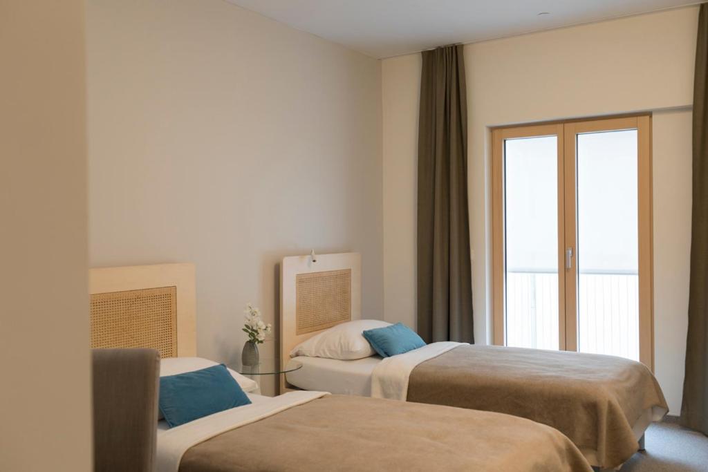 Postel nebo postele na pokoji v ubytování Art Hotel