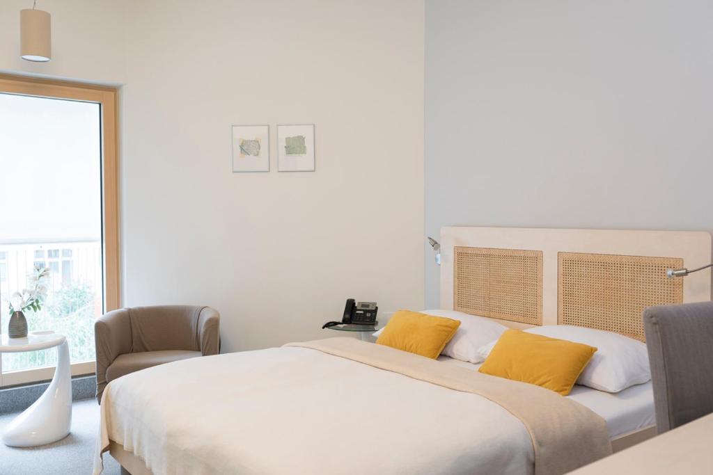 Postel nebo postele na pokoji v ubytování Art Hotel