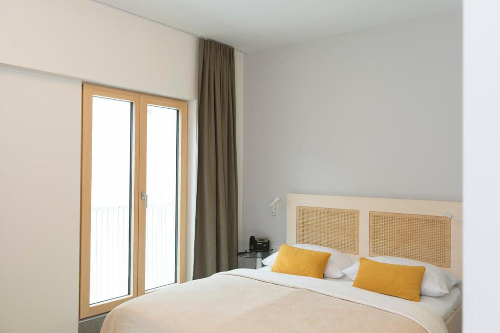 Postel nebo postele na pokoji v ubytování Art Hotel