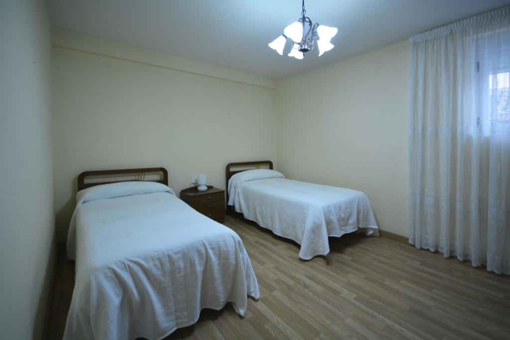 Posteľ alebo postele v izbe v ubytovaní La casa de El Burgo