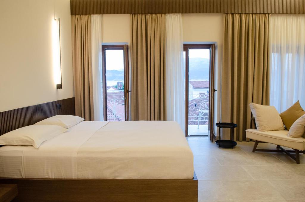 Posteľ alebo postele v izbe v ubytovaní Leone suites