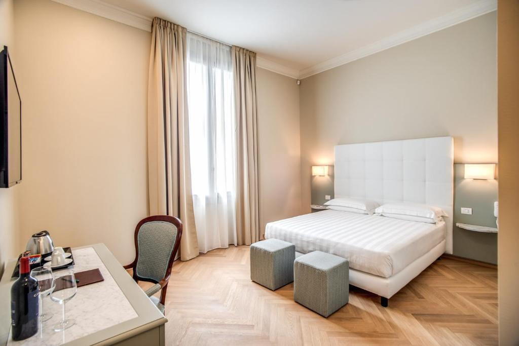 Postel nebo postele na pokoji v ubytování Hotel Ariele