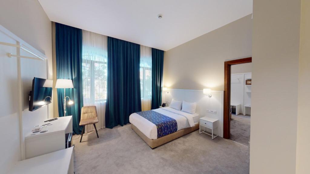 Postel nebo postele na pokoji v ubytování EPIGRAPH Design Kosher Hotel