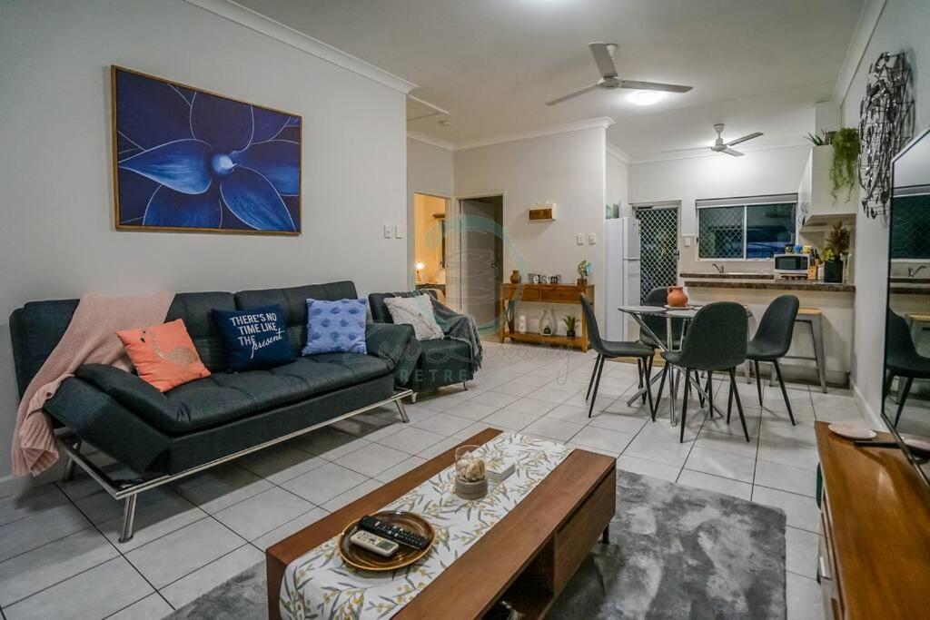 a living room with a couch and a table at ZEN HIDEAWAY COZY 2-BR/2-BA Modern Unit in Alawa in Casuarina