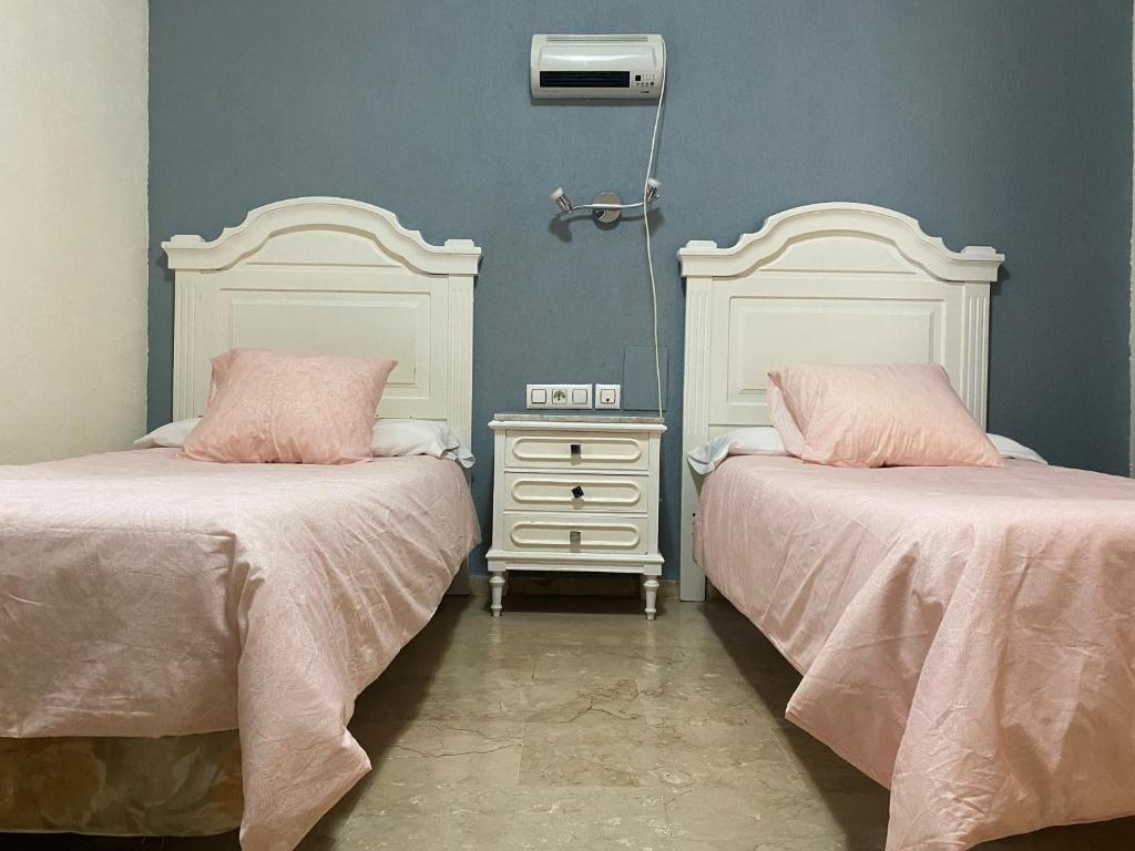 Postel nebo postele na pokoji v ubytování Hotel Medina Centro
