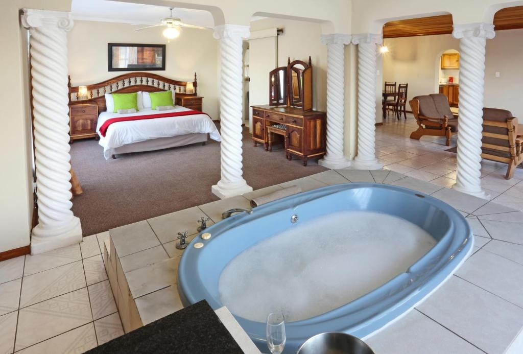 a large bathroom with a tub in a bedroom at Eagles Nest in Sedgefield