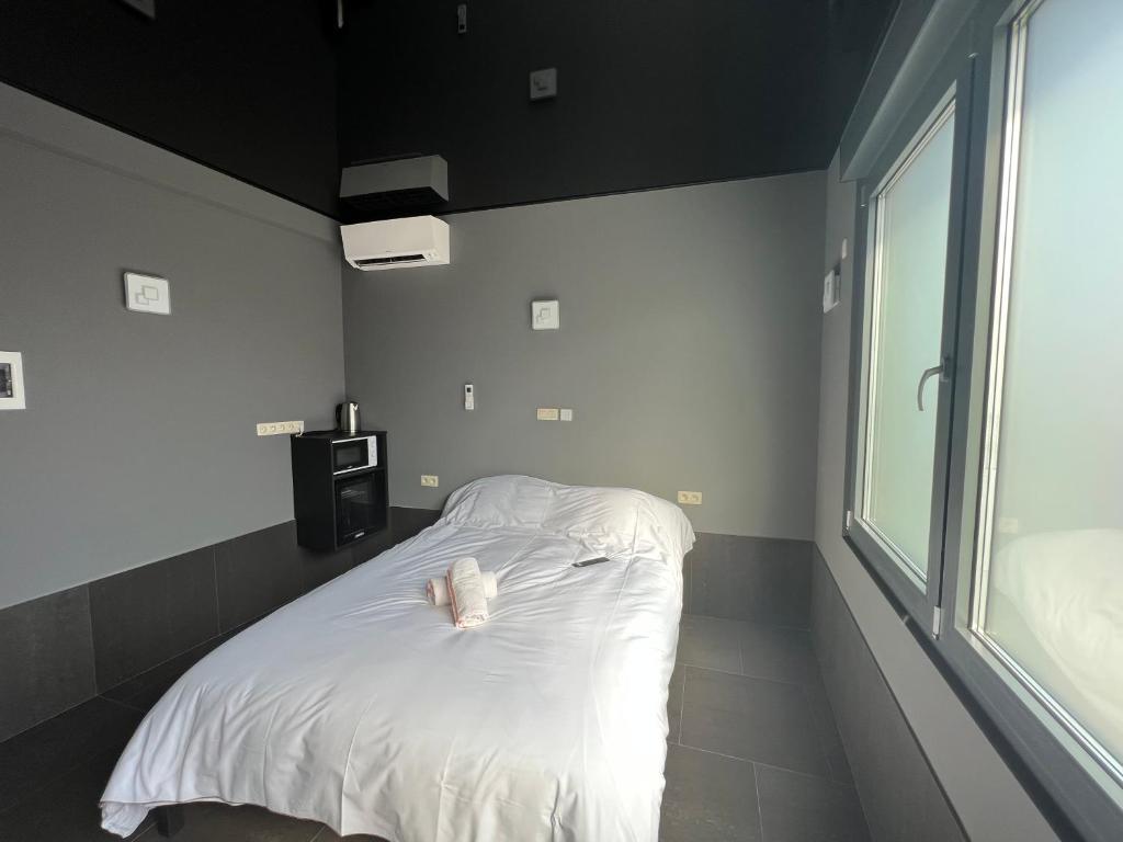 Postel nebo postele na pokoji v ubytování Logements des choraux