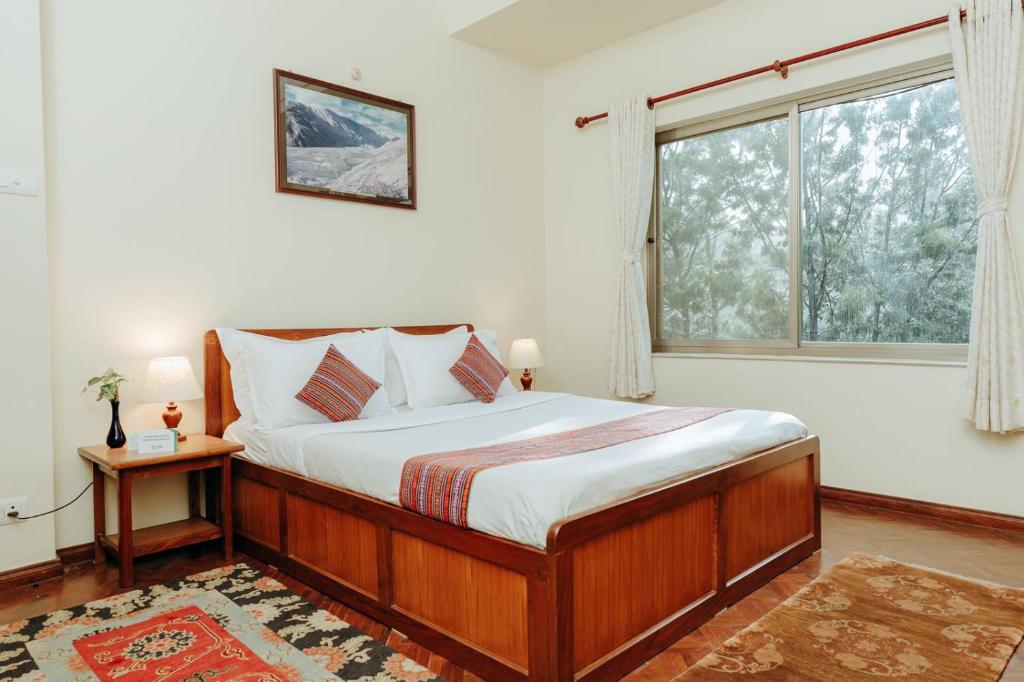 Postel nebo postele na pokoji v ubytování Tise Hotel