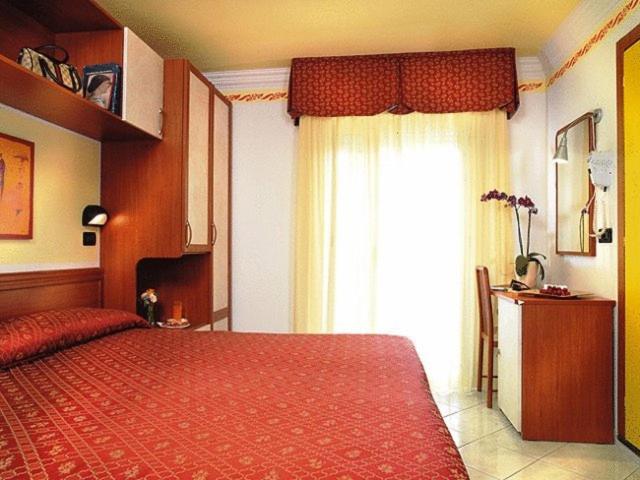 Postel nebo postele na pokoji v ubytování Hotel Grado