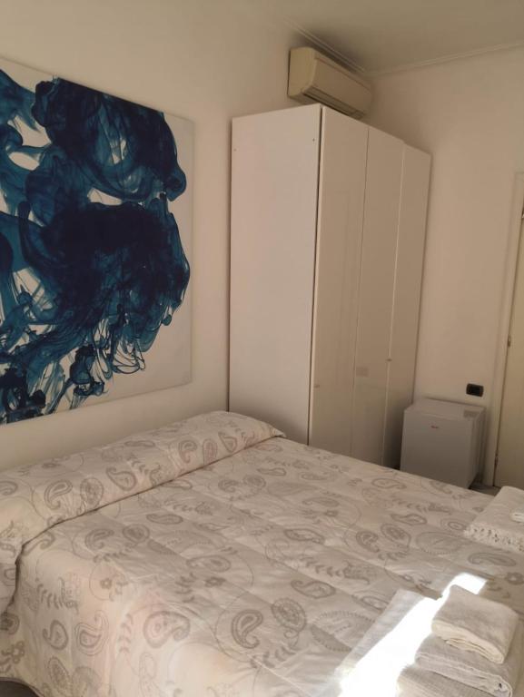 Postel nebo postele na pokoji v ubytování B&B Al Molo