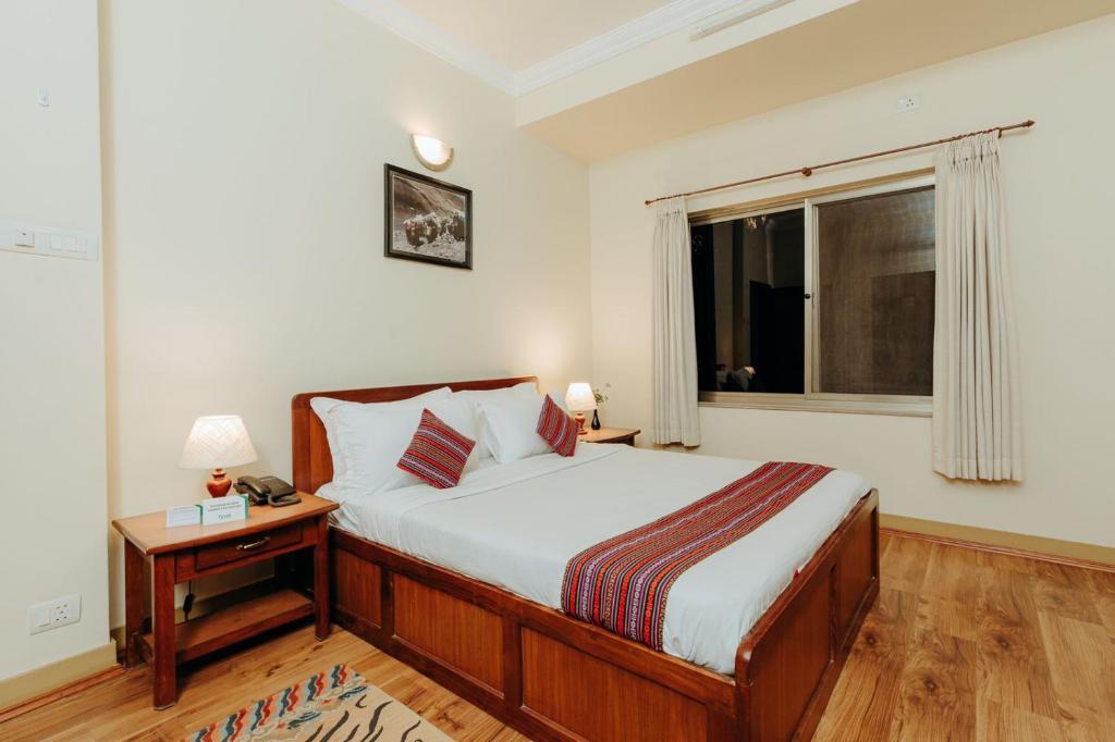 Postel nebo postele na pokoji v ubytování Tise Hotel