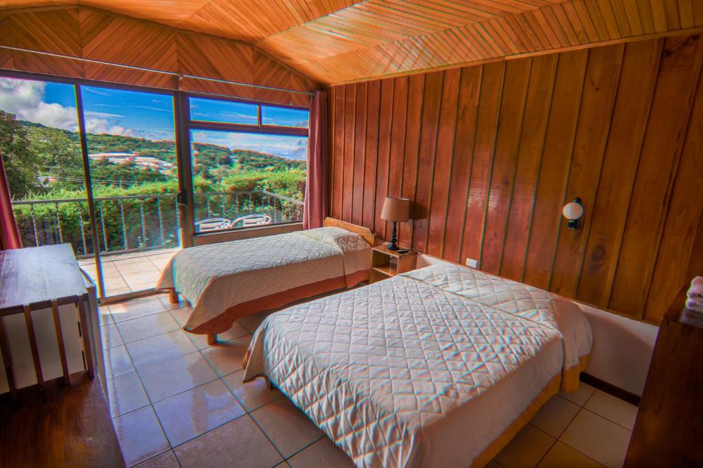 Postel nebo postele na pokoji v ubytování Hotel Don Taco