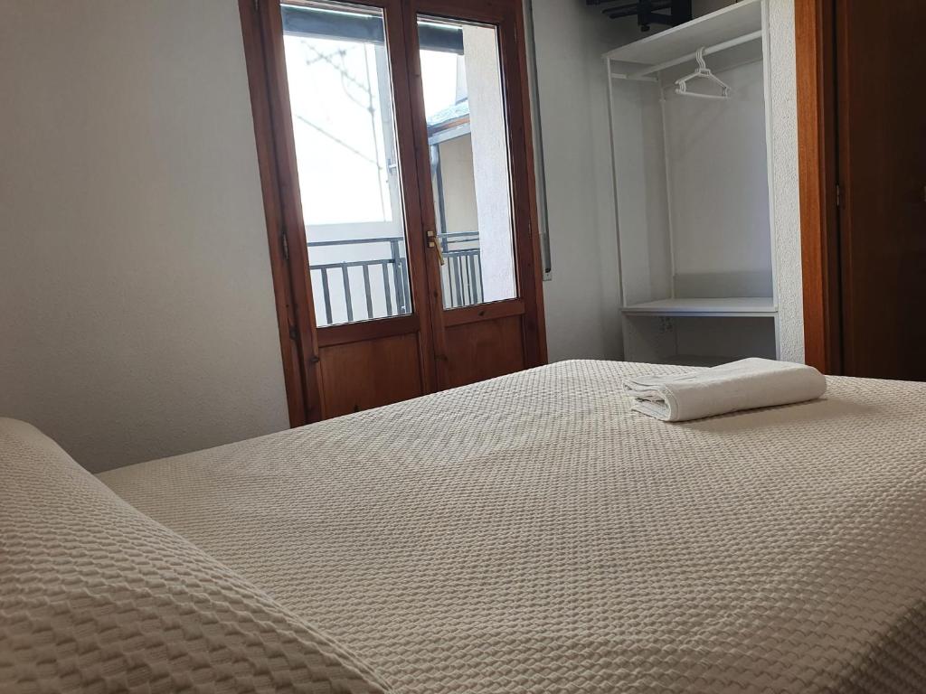 Postel nebo postele na pokoji v ubytování Hostal Apolo XI