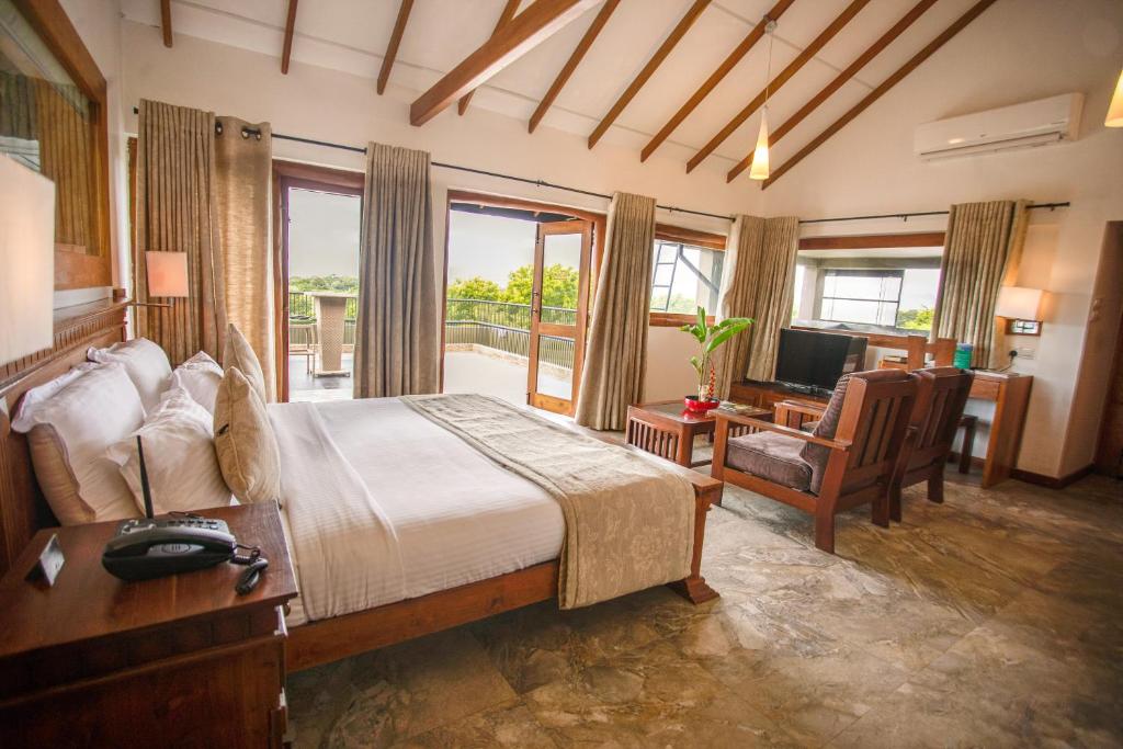 Postel nebo postele na pokoji v ubytování Kalu's Hideaway Udawalawe