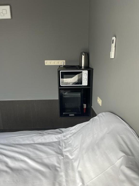 Postel nebo postele na pokoji v ubytování Logements des choraux